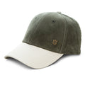 A two-tone baseball cap made of corduroy fabric, featuring an olive green crown and a contrasting off-white curved brim, with a small metallic shield logo on the front.